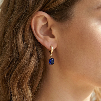 Aymie Earrings - Blue Stone Gold Jewelry Close-up | Premium Gemstone Huggie Hoop Earrings